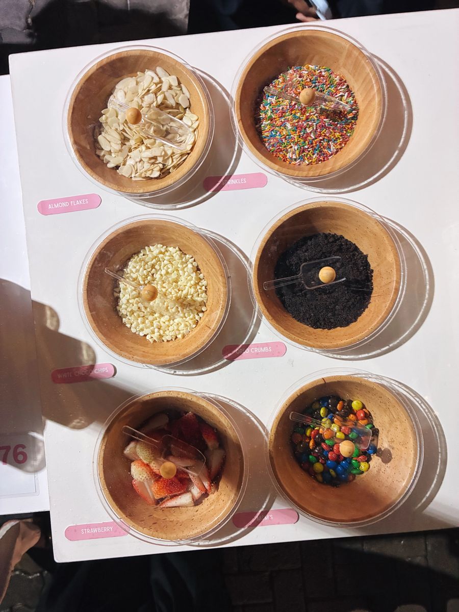 Topping bowls at the Crumbs & Co dessert cart
